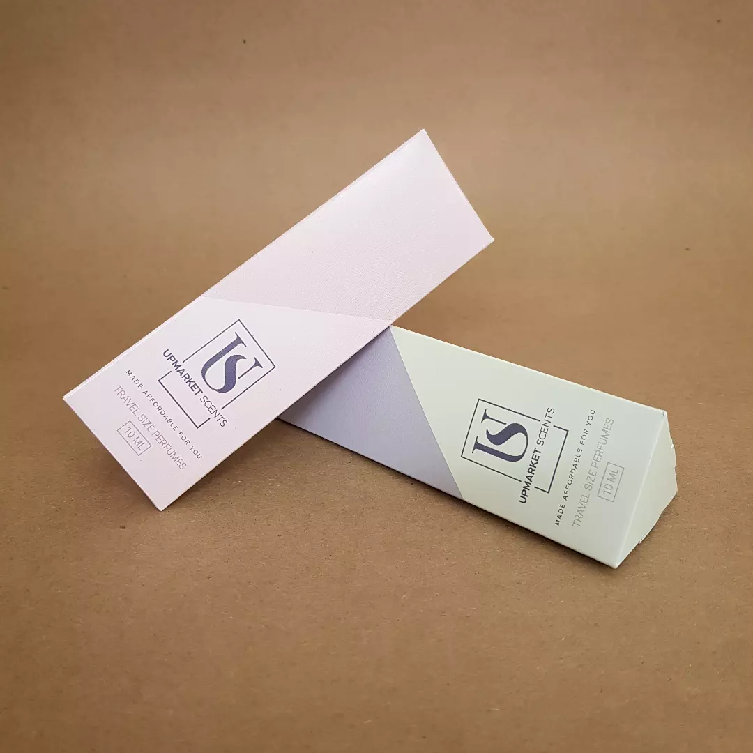 Upmarket Scents 10ml travel size perfume triangular folding cartons in blush pink and sage green